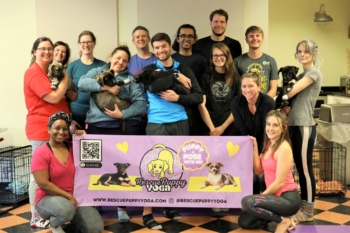 Puppy Yoga Group with banner
